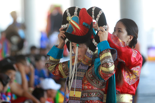 Performers take part in the opening ceremony of the year's Naadam Festival in Xinlin Gol, situated on the grasslands of the Inner Mongolia autonomous region, Aug 8, 2013.