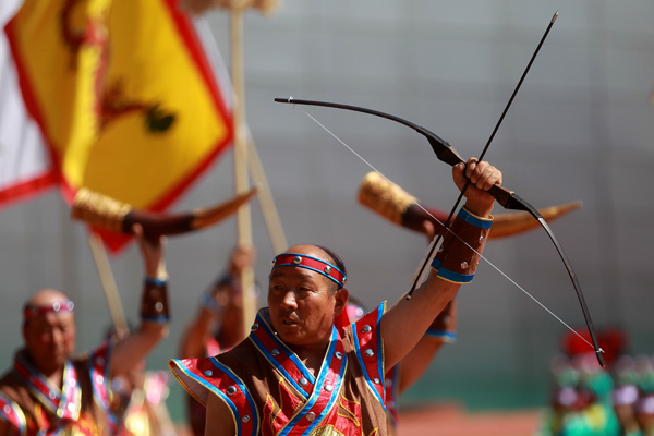 Performers take part in the opening ceremony of the year's Naadam Festival in Xinlin Gol, situated on the grasslands of the Inner Mongolia autonomous region, Aug 8, 2013.