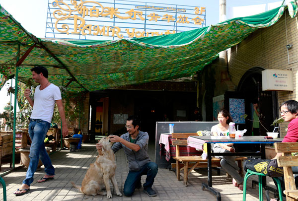 Chen Tao (center), runs the Pamir Youth Hostel in the center of the old town. Chen Tao (center), runs the Pamir Youth Hostel in the center of the old town.