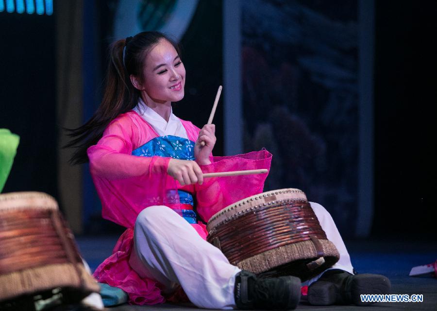 China's female percussion group, Red Poppy Ladies, auditions part of 'Mulan the Musical' for media in New York, the United States, on June 30, 2014. This is the second time the musical be put on stage in New York. [Photo/Xinhua]